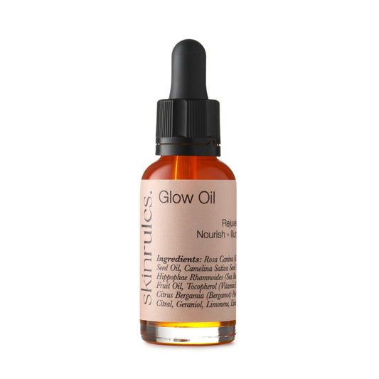 Glow Oil, Antioxidant Face Oil with Vitamins C & E, deep red colour in 30ml clear glass bottle with pipette.
